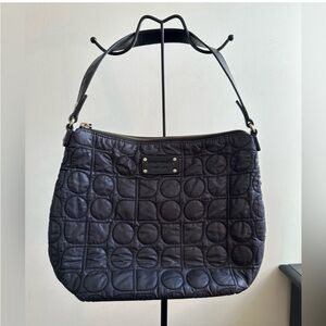 Kate Spade black nylon shoulder bag with circular quilted stitching and zip top